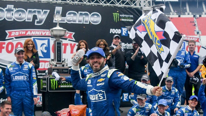 Jimmie Johnson celebrates in victory lane after winning the Food City 500, Monday at Bristol Motor Speedway.