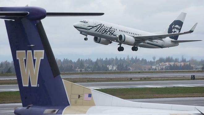 An Alaska Airlines Boeing 737 takes to the air in Seattle.