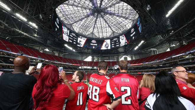 Fans check out the view of Mercedes-Benz Stadium before the Atlanta Falcons' preseason game against the Arizona Cardinals.