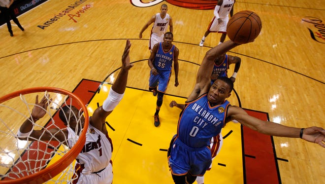2012: Russell Westbrook dunks over Chris Bosh during the first half of Game 4 of the 2012 NBA Finals.