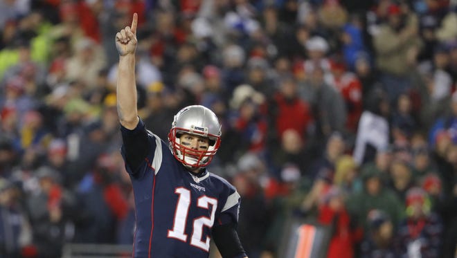New England Patriots quarterback Tom Brady (12) celebrates after a touchdown by running back LeGarrette Blount (not pictured) against the Pittsburgh Steelers during the third quarter in the 2017 AFC Championship Game at Gillette Stadium.