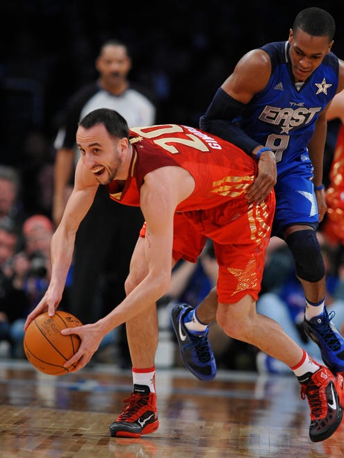 2011: Ginobili grabs a loose ball in front of Rajon Rondo during the All-Star Game.
