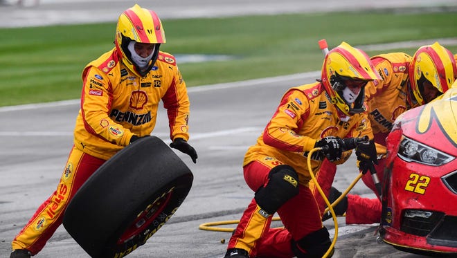 Joey Logano's crew works during a pit stop during the Folds of Honor QuikTrip 500 at Atlanta Motor Speedway on March 5. Brad Keselowski won.