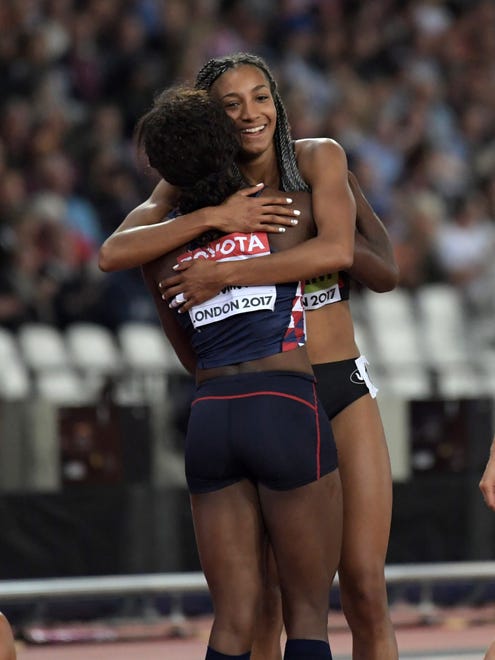 Nafissatou Thiam aka Nafi Thiam of Belgium embraces Antoinette Nana Djimou Ida of France after winning the heptathlon.