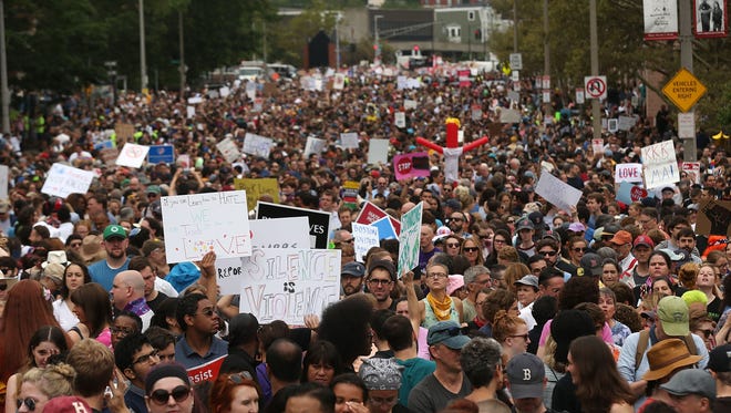 Thousands of protesters prepare to march in Boston against a planned free speech rally.