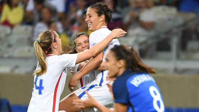 Team USA midfielder Carli Lloyd (10) celebrates her goal over France during the first round match at Estadio Mineirao.