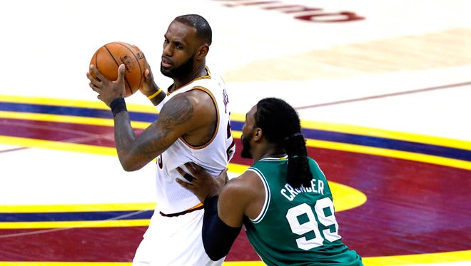 Cleveland Cavaliers forward LeBron James is defended by Boston Celtics forward Jae Crowder during the second half in game three of the Eastern conference finals of the NBA Playoffs.