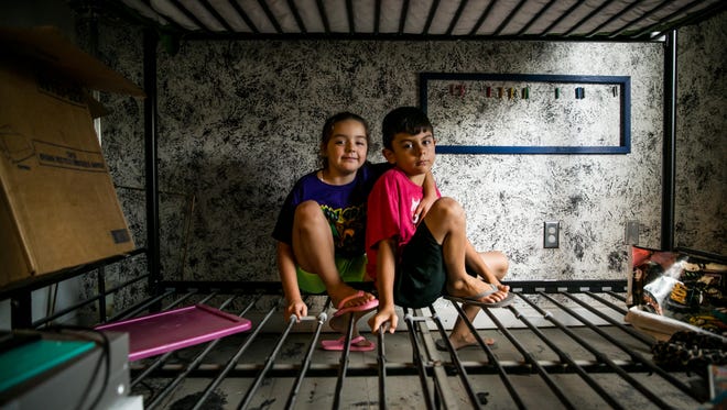 4.  Aiden (10) and his little sister, Jubilee (7), sit on what's left of their bunk beds in a home that was new to them just months ago. When talking about the kids and the impact of this event, Mrs Sigue, or "Mimi" told me, "Today we're going to call it an early day so that Aiden can celebrate his birthday, because not even this flood should get in the way of that." Baton Rouge, LA
