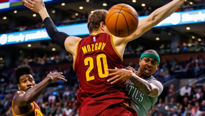 April 12, 2015: Isaiah Thomas (4) passes the ball against Cleveland Cavaliers center Timofey Mozgov (20) in the second quarter at TD Garden.