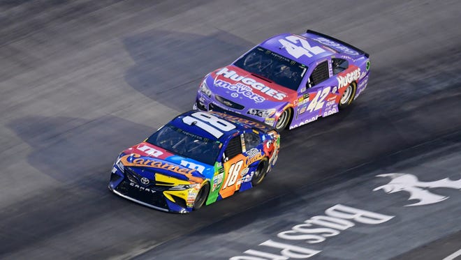 Kyle Larson (42) and Kyle Busch (18) during the Aug. 19 Bass Pro Shops NRA Night Race at Bristol Motor Speedway. Busch went on to win, completing the week sweep at Bristol.
