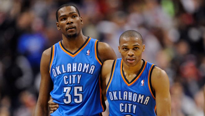 2012: Kevin Durant and Russell Westbrook look on during the second quarter against the Philadelphia 76ers.