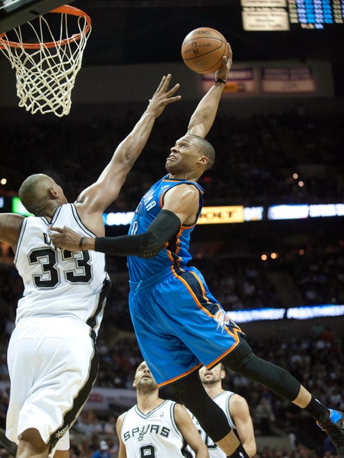 2012: Russell Westbrook goes up for a dunk over San Antonio Spurs forward Boris Diaw.