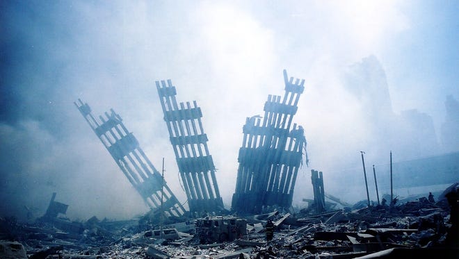 The rubble of the World Trade Center smolders Sept. 11, 2001.