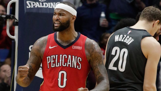 2017: New Orleans Pelicans center DeMarcus Cousins (0) reacts after a dunk by forward Anthony Davis (not pictured) during the second half against the Brooklyn Nets.