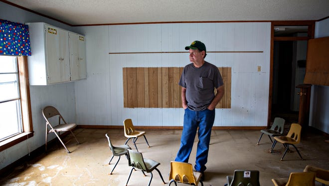 1. Ronnie Carroll, 70, a mission worker from Roberstdale, Alabama, stands in a children's bible study room in First Baptist Church. "It's heartbreaking....I believe a tornado is better because you just lose everything at once, and it's gone, it takes it with it. A flood, they can see it. They can touch it, and they want to fix it but can't." Baker, LA.