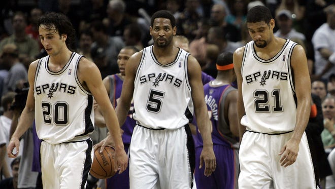 2005: Ginobili, Robert Horry and Tim Duncan during Game 4 of the Western Conference finals against the Phoenix Suns.
