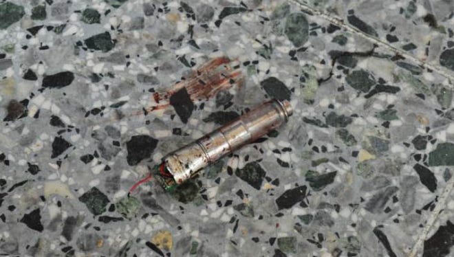 This photo obtained May 24, 2017 from The New York Times who got it from British Law Enforcement, shows what the bomber in the Manchester terrorist attack appeared to have carried as a powerful explosive in a lightweight metal container concealed within a blue Karrimor backpack, and to have held a small detonator in his left hand, according to preliminary information gathered by British authorities in Manchester, England.