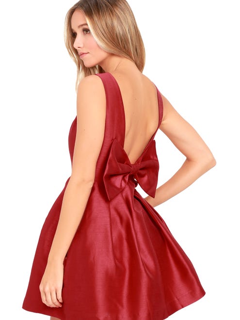 A short and flirty prom dress with a deep plunging back.