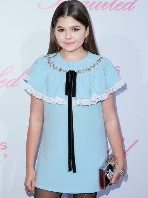 Actor Addison Riecke, one of the younger stars of the film, arrived at the premiere in a cute, powder blue dress paired with bedazzled tights.