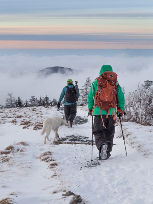 Hikers hit the A.T. in the wintertime on Round Bald near Bakersville, North Carolina.
