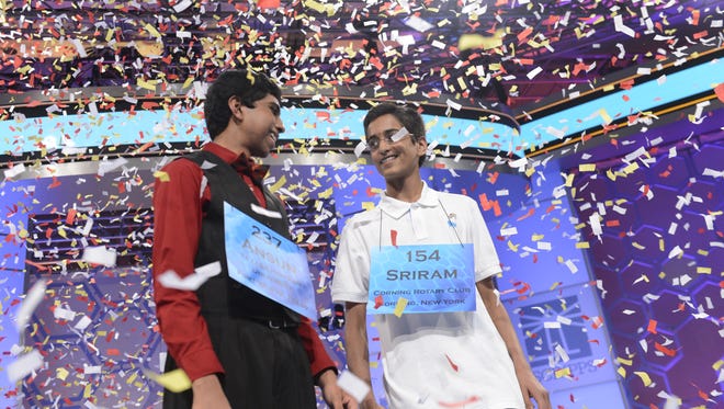 Ansun Sujoe and Sriram Hathwar celebrate being co-champions at the 2014 Scripps National Spelling Bee in National Harbor, Md.