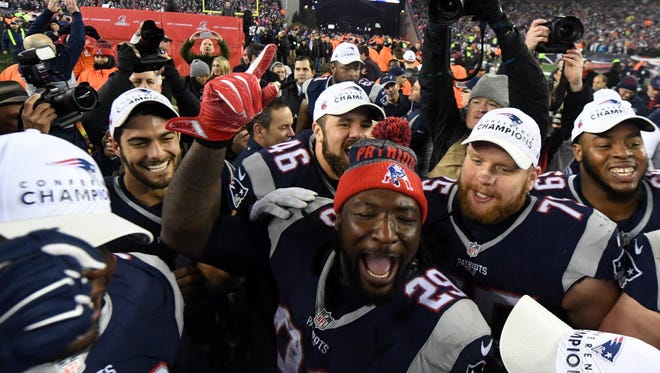 Patriots running back LeGarrette Blount (29) celebrates with teammates after beating the Steelers.
