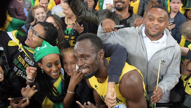 Usain Bolt soaks up the adoration of the fans.