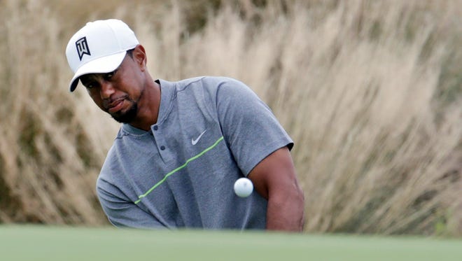 Tiger Woods chips onto the third green during Round 3 of the Hero World Challenge.
