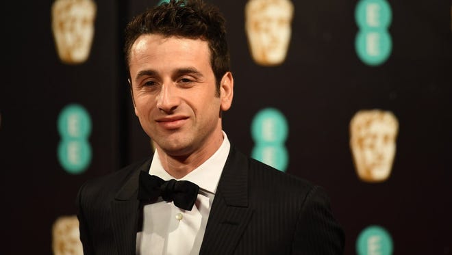 Justin Hurwitz poses upon arrival at the BAFTA British Academy Film Awards at the Royal Albert Hall in London on February 12, 2017.