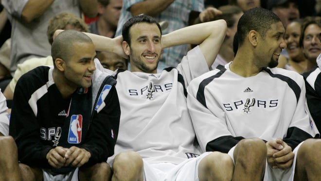 2007: Ginobili cracks a big smile as he sits between teammates Tony Parker and Tim Duncan in Game 5 of the Western Conference finals.