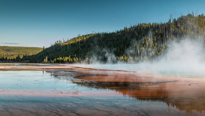 Steam rises from the water at Yellowstone National Park on July 26, 2015.