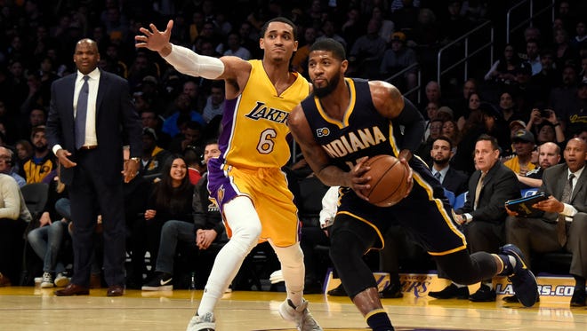 Indiana Pacers forward Paul George (13) drives to the basket against Los Angeles Lakers guard Jordan Clarkson (6) during the second quarter at Staples Center.
