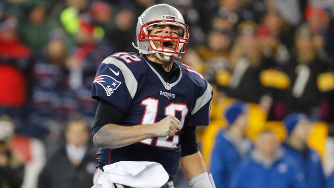 Patriots quarterback Tom Brady (12) celebrates after a third-quarter touchdown.