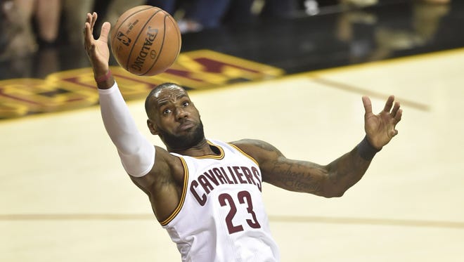 Cleveland Cavaliers forward LeBron James (23) reaches for an errant pass in the first quarter against the Toronto Raptors in Game 2.