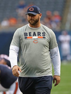 Kyle Long of the Chicago Bears encourages teammates during warm-ups before a preseason game against the Denver Broncos at Soldier Field.