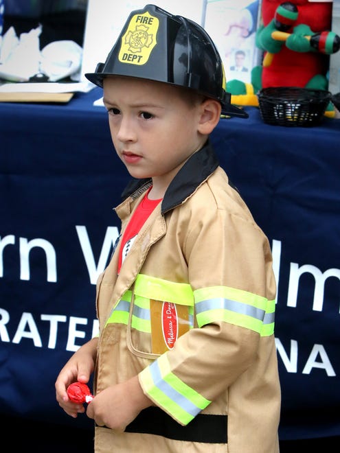 Nolan Smeby, 4, arrived in his own turnout gear for Glendale's National Night Out in the parking area behind Glendale City Hall on Aug. 16.