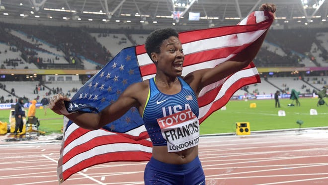 Phyllis Francis takes a victory lap with the United States flag after wining the women's 400-meter race in 49.92 seconds during the IAAF World Championships in Athletics at London Stadium at Queen Elizabeth Park.