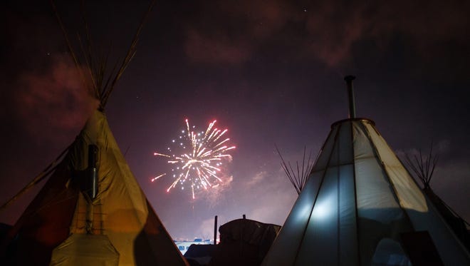 Fireworks go off in the Oceti Sakowin Camp close to the Standing Rock Reservation on Sunday, Dec. 4, 2016 near Cannon Ball. Today, the Army Corps of Engineers denied Dakota Access an easement to cross the Missouri River.