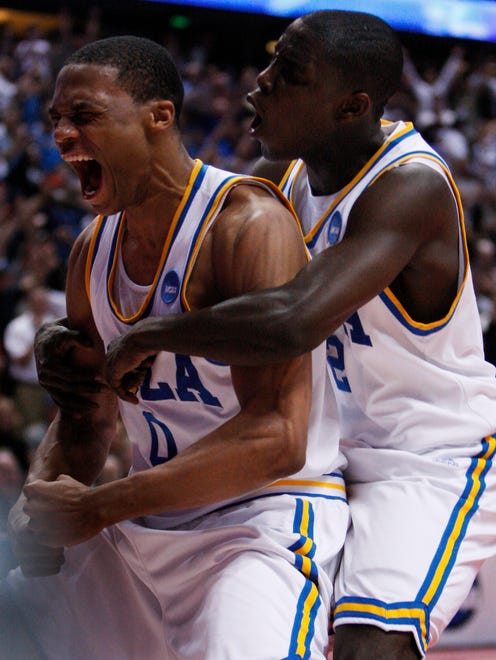2008: UCLA's Russell Westbrook celebrates his game-ending slam dunk as he's hugged by teammate Darren Collison.