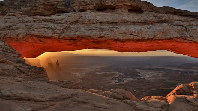 It's a rite of passage, contributor Mark Doiron says, for all visitors to the Mesa Arch in the Canyonlands.