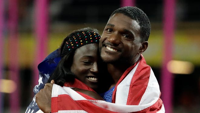 United States Justin Gatlin embraces Tori Bowie after the men's 4x100 relay final in which the USA took the silver medal during the World Athletics Championships in London Aug. 12. Bowie won gold in the women's 4x100.