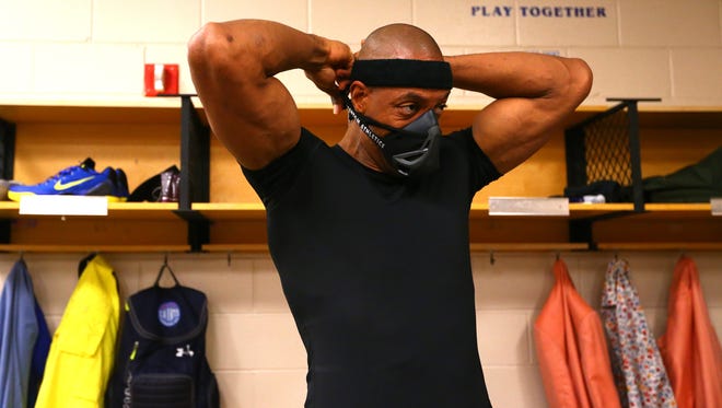 Jerome Williams of Power prepares in the locker room.