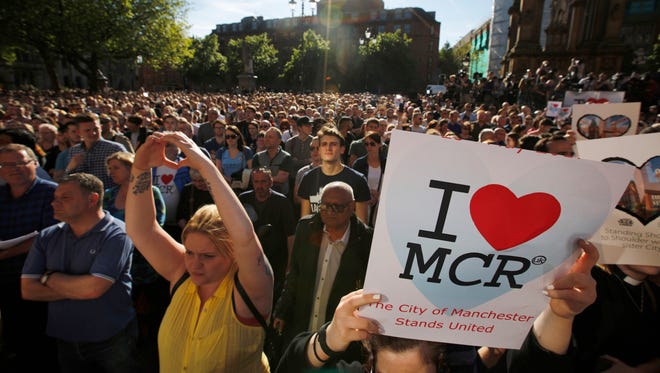 Crowds gather for a vigil in Albert Square in Manchester, England, on May 23, 2017, the day after the suicide attack at an Ariana Grande concert.