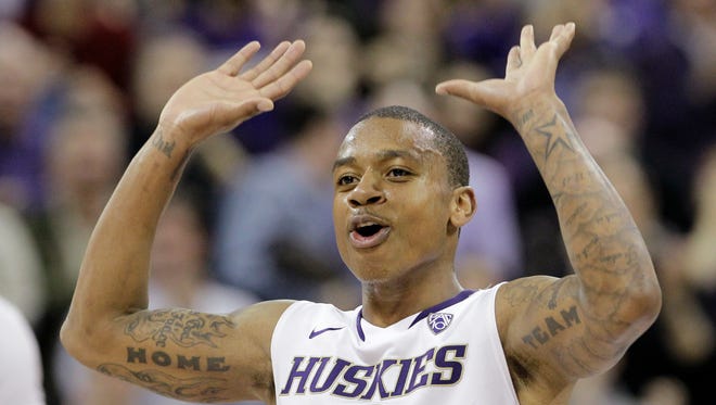 Jan. 20, 2011: Isaiah Thomas encourages the crowd after scoring against Arizona in the second half of an NCAA college basketball game.