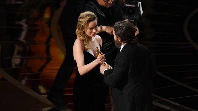 Casey Affleck  accepts the Oscar for Best Actor for his role in 'Manchester by the Sea' from Brie Larson during the 89th Academy Awards.