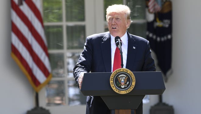 President Trump announces his decision on the Paris climate agreement in the Rose Garden of the White House on June 1, 2017.
