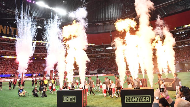 Atlanta United walks out onto the field for their game against the FC Dallas at Mercedes-Benz Stadium.