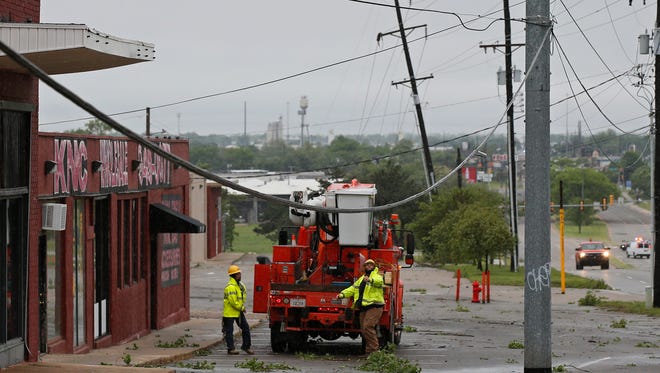 Crews prepare to repair damaged power lines in Oklahoma City on April 29, 2017.