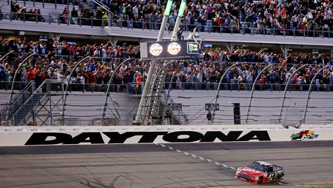 Kurt Busch crosses the finish line to win the Daytona 500 at Daytona International Speedway on Feb. 26.