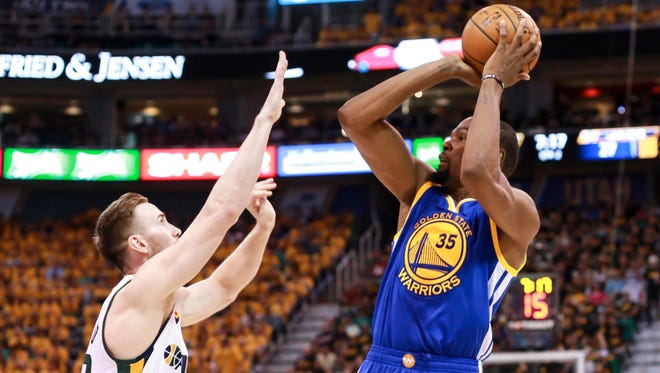 Golden State Warriors forward Kevin Durant shoots the ball over Utah Jazz forward Gordon Hayward during the second quarter in Game 3.